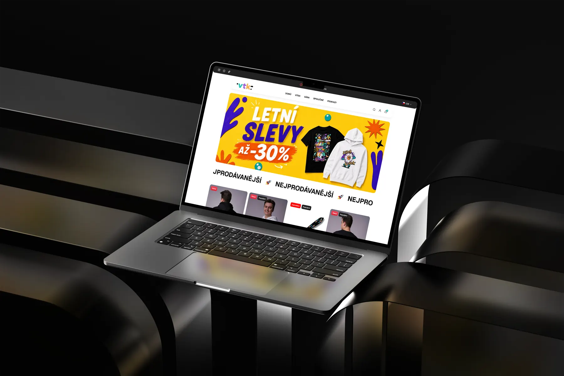 E-shop vitekshop.cz s vlastní grafikou kampaně a nabídkou merche na notebooku